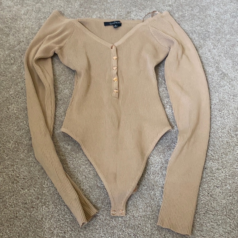 Slight of the shoulder body suit